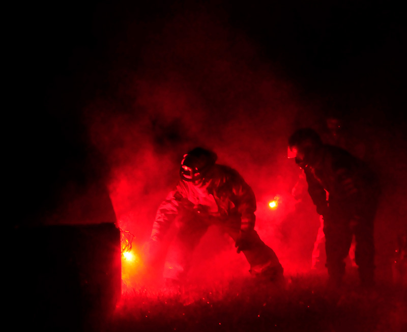 Fireman lighting a 4-inch shell